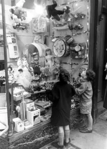 A couple of children look longingly at the wonderful toys on display in their local A couple of children look longingly at the wonderful toys on display in their local