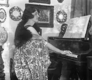 English actress, Miss Marjorie Hume seated at her piano English actress, Miss Marjorie Hume seated at her piano