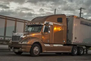 Freightliner 6x4 semi with a box trailer parked up on HY 401 service station SW Freightliner 6x4 semi with a box trailer parked up on HY 401 service station SW