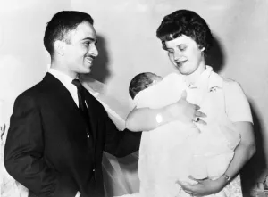 A happy King Hussein of Jordon looks on as his British born wife Princess Muna admires A happy King Hussein of Jordon looks on as his British born wife Princess Muna admires