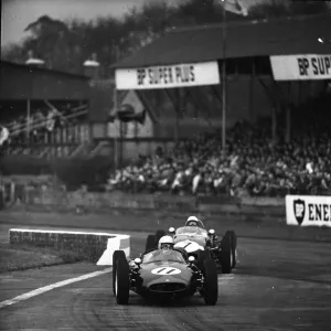 John Surtees 11 and Stirling Moss 7 racing in the Goodwood International 100 for John Surtees 11 and Stirling Moss 7 racing in the Goodwood International 100 for