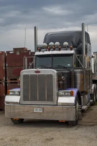 Portrait of a peterbilt 6x4 semi tractor unit. Note ; Check-out those wheel nuts Portrait of a peterbilt 6x4 semi tractor unit. Note ; Check-out those wheel nuts