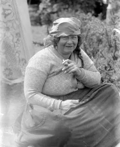 A Romany gypsy woman smoking her pipe at the Epsom Races. Late 1940s, early 1950s A Romany gypsy woman smoking her pipe at the Epsom Races. Late 1940s, early 1950s