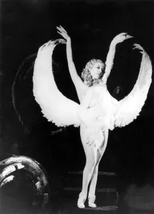 Sally Rand of Fan Dance fame is shown in one of the positions in her new dance which Sally Rand of Fan Dance fame is shown in one of the positions in her new dance which