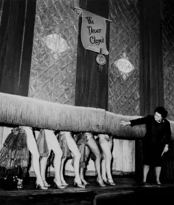 Windmill Theatre Owner Miss Sheila Van Dam watches as the curtain comes down over Windmill Theatre Owner Miss Sheila Van Dam watches as the curtain comes down over