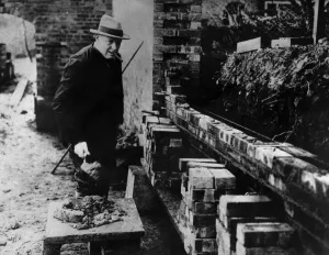 Winston Churchill building a wall at his house Chartwell near Westerham Kent. At Winston Churchill building a wall at his house Chartwell near Westerham Kent. At