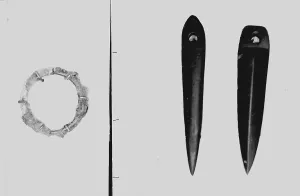 Bronze ring and casts of slate needles from the Iron Age cemetery at Harlyn Bay Bronze ring and casts of slate needles from the Iron Age cemetery at Harlyn Bay