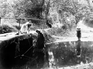 Three girls fishing in the River Kenwyn at the ford and footbridge, Treliske Lane, Newmills, Kenwyn, Cornwall Three girls fishing in the River Kenwyn at the ford and footbridge, Treliske Lane, Newmills, Kenwyn, Cornwall