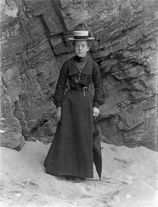 Victorian Era Photography Prints: Lady standing below cliff at Padstow, Cornwall. Probably 1890s or early 1900s