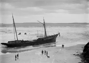 Prints of A view of the Bessie wrecked at Carbis Bay, broadside to the surf, with the machinery of the Vulture beyond Cornwall Prints: Print of the SS Bessie wrecked at Carbis Bay, Cornwall