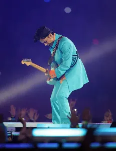 Prints of US musician Prince performs during half-time 04 February 2007 at Super Bowl XLI at Dolphin Stadium in Miami between the Chicago Bears and the Indianapolis Colts Music Prints: Print of Prince performing at Super Bowl XLI