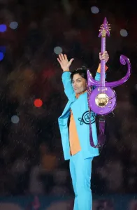 Prints of US musician Prince performs during half-time 04 February 2007 at Super Bowl XLI at Dolphin Stadium in Miami between the Chicago Bears and the Indianapolis Colts Music Prints: Prince performs at Super Bowl XLI Print