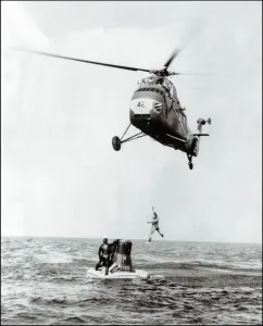 Print of John Glenn being evacuated from Friendship 7 by helicopter