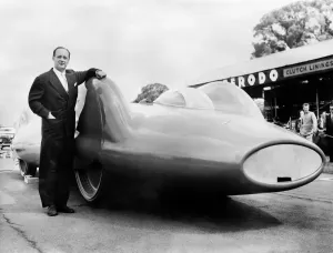 Donald Campbell Prints: Print of Donald Campbell posing near the Bluebird CN7 in England, July 1960