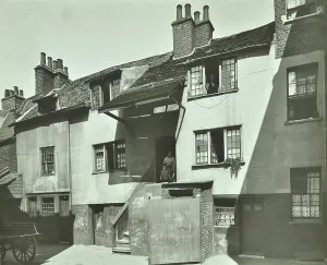 Prints of GHL1787996 Crooked Billet Yard: slum houisng, 1923 (b/w photo) by English Photographer, (20th century); London Metropolitan Archives, City of London; (add.info.: Crooked Billet Yard: slum houisng) Slums Prints: Black and white photograph print of a London slum housing scene