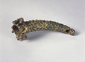 Side blown horn with ray skin covering and human jawbone attachment (brass) Side blown horn with ray skin covering and human jawbone attachment (brass)