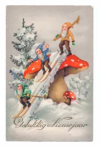 Edwardian postcard of three gnomes in the snow sliding down a large mushroom, c Edwardian postcard of three gnomes in the snow sliding down a large mushroom, c