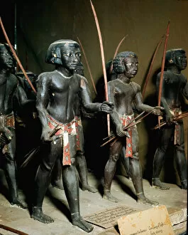 Asyut Collection: Egyptian antiquite: sculpted wooden group of Nubian archers representing the army of