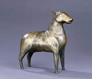 A Fatimid brass figure of a roe deer in naturalistic form, 11th-12th century (brass) A Fatimid brass figure of a roe deer in naturalistic form, 11th-12th century (brass)
