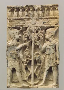 Furniture plaque carved in high relief with two Egyptianizing figures flanking a volute Furniture plaque carved in high relief with two Egyptianizing figures flanking a volute