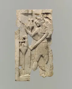 Furniture plaque carved in relief with lion-headed figure, c.8th-7th century B.C. (ivory) Furniture plaque carved in relief with lion-headed figure, c.8th-7th century B.C. (ivory)