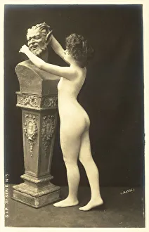 Girl in body stocking paying attentions to bust of satyr (b/w photo) Girl in body stocking paying attentions to bust of satyr (b/w photo)