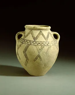 An Iranian pottery vase of ovoid form with two loop handles and a rounded rim, with black painted geometric patten, c An Iranian pottery vase of ovoid form with two loop handles and a rounded rim, with black painted geometric patten, c