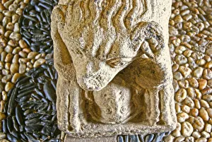 Lion eating a man, base of sarcophagus of D. Afonso Pires, former Bishop of Porto, Lamego Lion eating a man, base of sarcophagus of D. Afonso Pires, former Bishop of Porto, Lamego