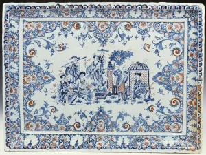 A Rouen rectangular ceramic tray, painted in blue and iron-red