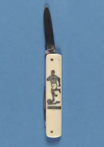 Penknife depicting a footballer (metal & bone) Penknife depicting a footballer (metal & bone)