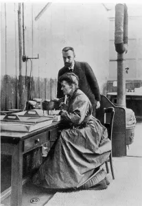 Pierre (1859-1906) and Marie Curie (1867-1934) in their laboratory, c.1903 (b/w photo) Pierre (1859-1906) and Marie Curie (1867-1934) in their laboratory, c.1903 (b/w photo)