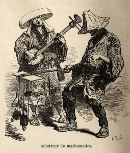 The puppetry show and the musician who accompanies him for street entertainment The puppetry show and the musician who accompanies him for street entertainment