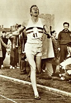 Roger Bannister breaking the tape to become the first man to run a mile in four minutes (b/w photo) Roger Bannister breaking the tape to become the first man to run a mile in four minutes (b/w photo)