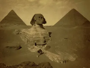 Egyptian Antiquities Photography Prints: Three men, one with camel, on paw of the Sphinx, two pyramids in background. 1880 (photo)