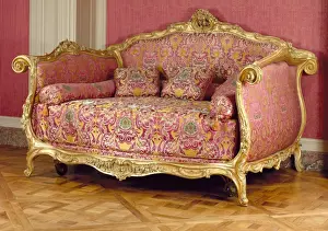 Print of a large, intricately gilded bed