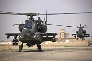 Two AH-64 Apache helicopters return from a mission over Iraq Two AH-64 Apache helicopters return from a mission over Iraq