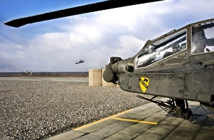 An AH-64D Apache helicopter at a military base in Afghanistan An AH-64D Apache helicopter at a military base in Afghanistan