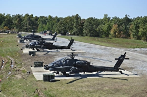 An air crew starts their AH-64D Apache helicopters at Fort Campbell An air crew starts their AH-64D Apache helicopters at Fort Campbell