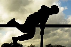 An Airman scales an obstacle at Camp Bullis, Texas An Airman scales an obstacle at Camp Bullis, Texas