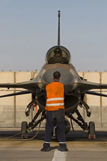 Airman signals to the pilot of an F-16A Netz of the Israeli Air Force Airman signals to the pilot of an F-16A Netz of the Israeli Air Force