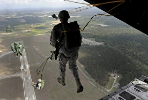 Airmen jump out of an HC-130P/N Combat King over Geogia Airmen jump out of an HC-130P/N Combat King over Geogia