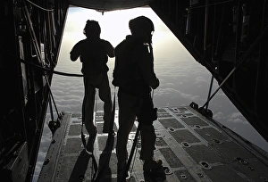 Airmen prepare for a HALO jump aboard an HC-130 over Djibouti Airmen prepare for a HALO jump aboard an HC-130 over Djibouti