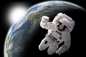 Astronaut floating in outer space with visible sunrise from an Earth-like planet Astronaut floating in outer space with visible sunrise from an Earth-like planet