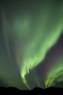 Aurora borealis over mountain, Fish Lake, Yukon, Canada Aurora borealis over mountain, Fish Lake, Yukon, Canada