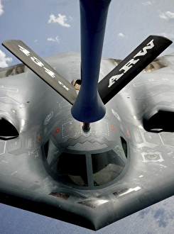 A B-2 Spirit aircraft getting in position to refuel from a KC-135 Stratotanker over A B-2 Spirit aircraft getting in position to refuel from a KC-135 Stratotanker over