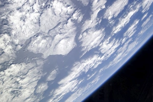 A blue and white part of Earth and the blackness of space viewed from the Earth-orbiting A blue and white part of Earth and the blackness of space viewed from the Earth-orbiting