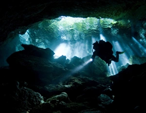 Cenote diver enters Taj mahal cavern on Yucatan peninsula in Mexico Cenote diver enters Taj mahal cavern on Yucatan peninsula in Mexico