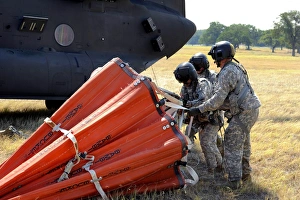 CH-47 Chinook helicopter crew prepare to install the Bambi Bucket on the aircraft CH-47 Chinook helicopter crew prepare to install the Bambi Bucket on the aircraft