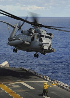 A CH-53E Sea Stallion helicopter takes off from amphibious assault ship USS Essex A CH-53E Sea Stallion helicopter takes off from amphibious assault ship USS Essex