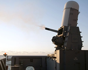 A close-in weapons system fires a burst of tungsten rounds A close-in weapons system fires a burst of tungsten rounds